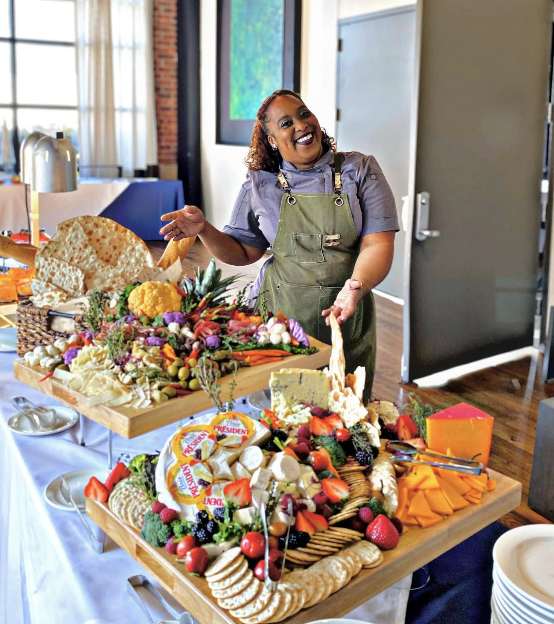 Chef Fallon presenting beautiful catering spread